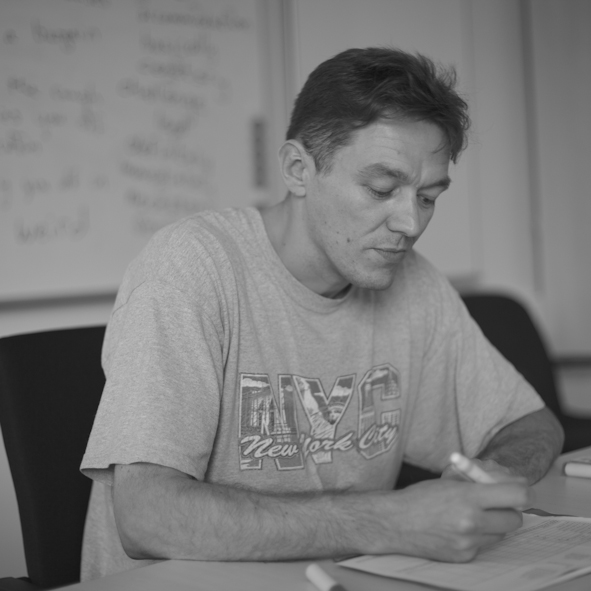 Ian Bennett working with teaching materials in a classroom